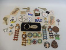 A collection of assorted RAC enamel and plastic badges including two Rally of Great Britain enamel