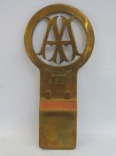 An AA Stenson Cooke type 3 brass car badge, designed to fit the dashboard of certain car marques,