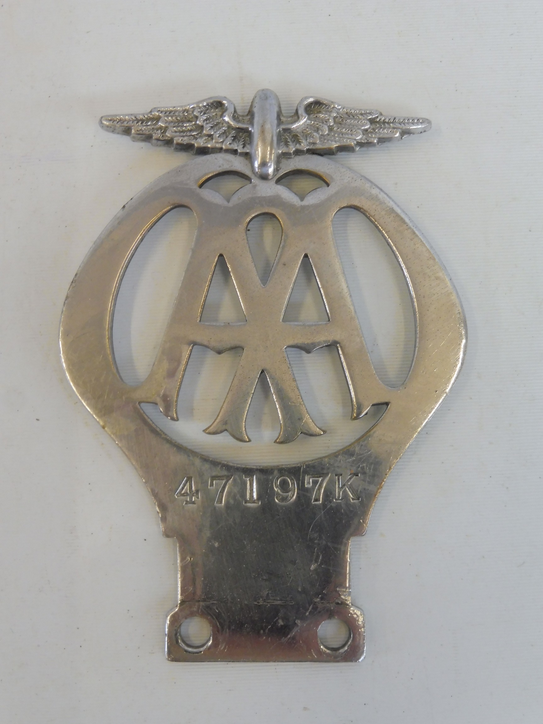 An AA motorcycle badge type 2 stamped 47197K, chrome plated brass.