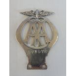 An AA motorcycle badge type 2 stamped 47197K, chrome plated brass.