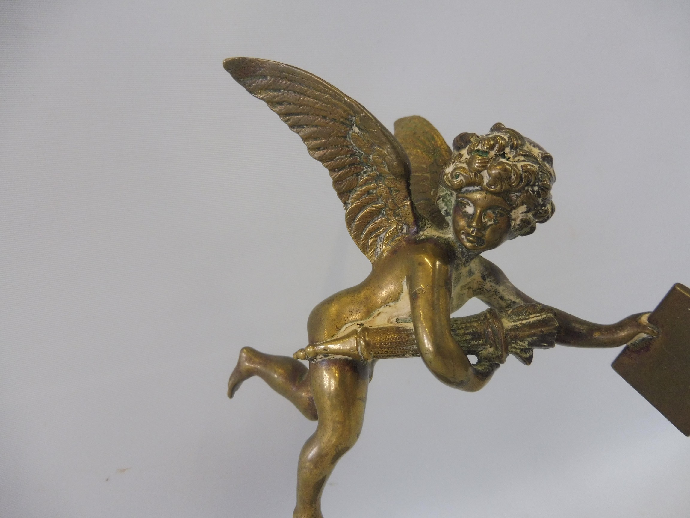 A polished brass accessory mascot in the form of a winged cherub, display base mounted. - Image 2 of 5