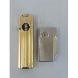 A 'Motorist Pipe Lighter', made in England plus a Mercedes Benz Colibri Executive lighter.