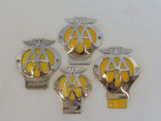 Two large domed AA badges, one with badge bar mounting, plus two others with different yellow backs.