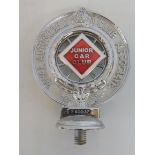 A Royal Automobile Club Associate car badge with red and white enamel centre for Junior Car Club,