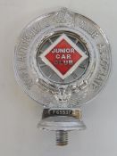 A Royal Automobile Club Associate car badge with red and white enamel centre for Junior Car Club,