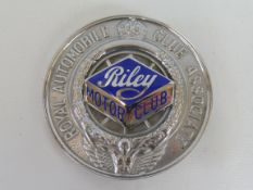 A Royal Automobile Club Associate car badge with unusual Riley Motor Club enamel centre.