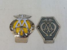 An AA Commercial badge, no. V200450 and an AA car badge no. IC06911.