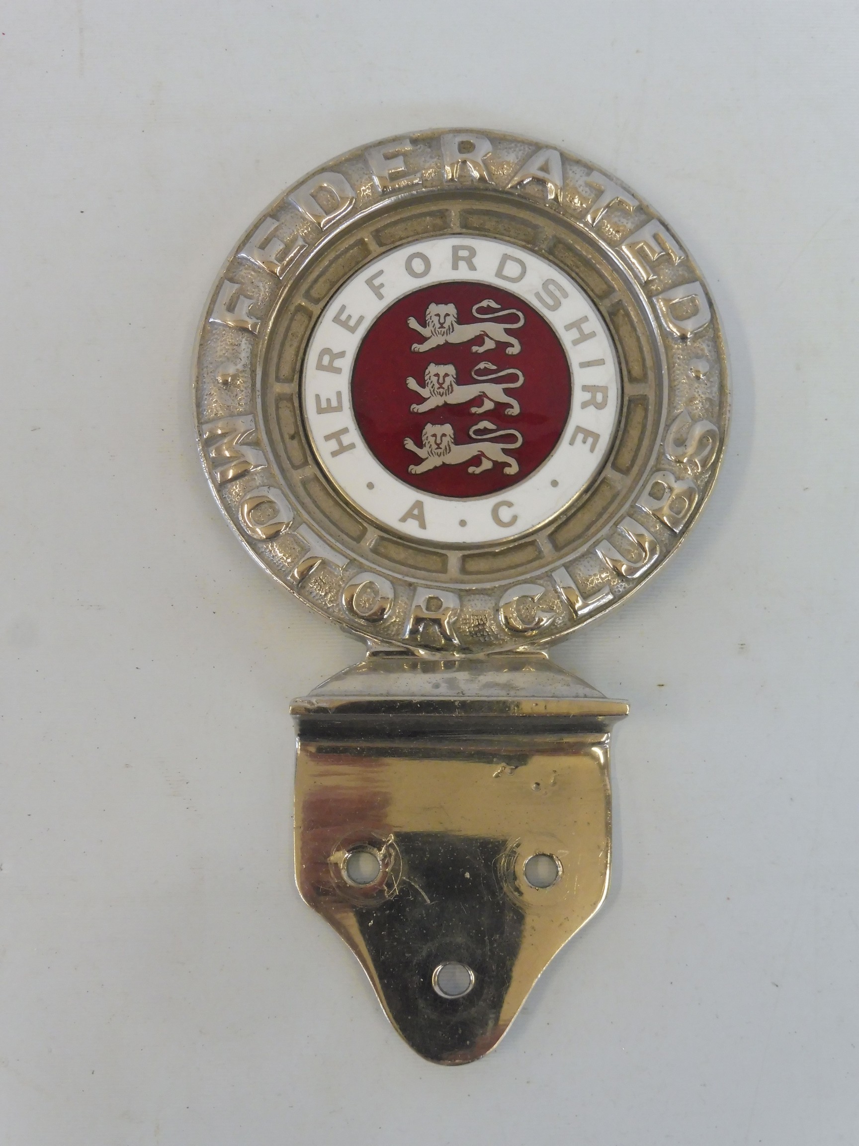 A rare Federated Motor Clubs type 1 car badge with Herefordshire A.C. enamel centre, made by