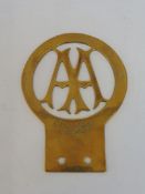 An AA Stenson Cooke official replica brass badge.
