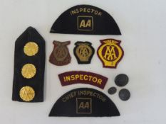 Three highly gilded AA rosette type buttons on a jacket lapel, three black AA buttons and a small