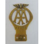 An AA 1911 brass winged type car badge, produced 1911-24, this was the first winged model after