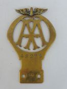 An AA 1911 brass winged type car badge, produced 1911-24, this was the first winged model after