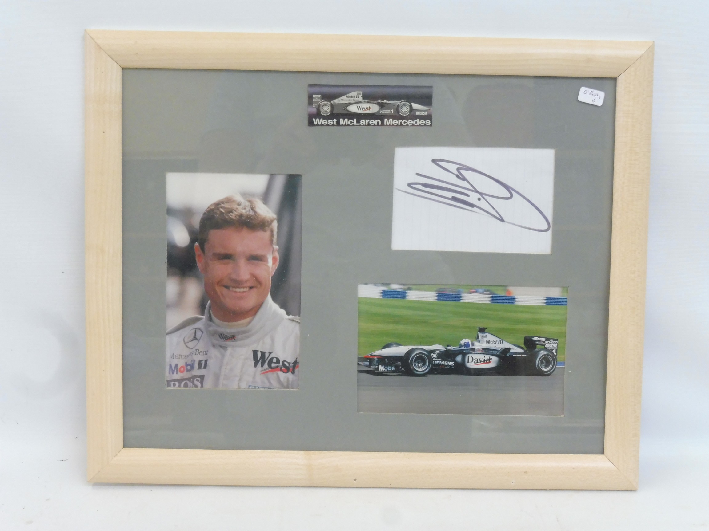 A framed David Coulthard/McLaren Mercedes autograph and photograph presentation, 15 3/4 x 12 3/4".