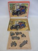A cased Victory jigsaw puzzle of a 1904 Renault, complete, plus six highly detailed lead gaming
