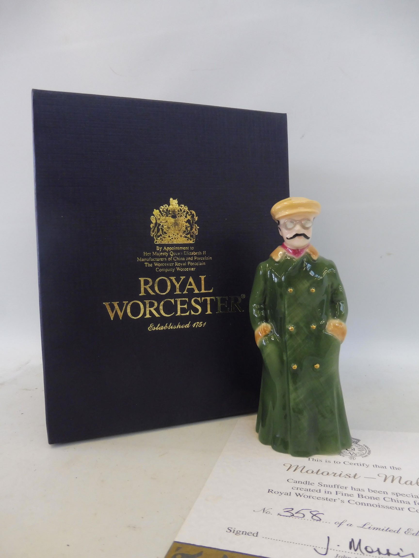 A boxed limited edition Royal Worcester porcelain figure of an Edwardian gentleman motorist candle