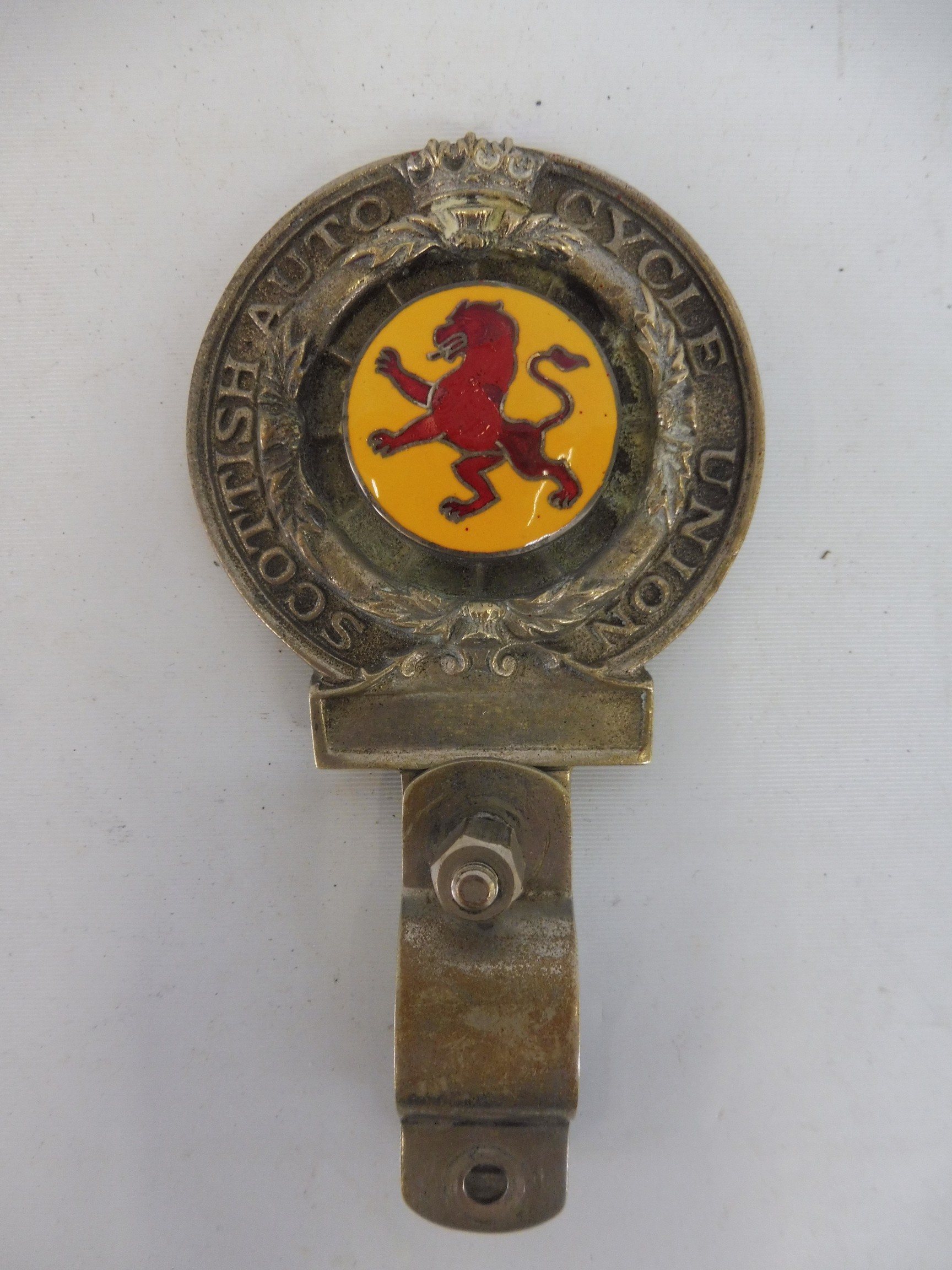 A Royal Scottish Auto Cycle Union motorcycle handlebar mounted badge type 2 with yellow and red