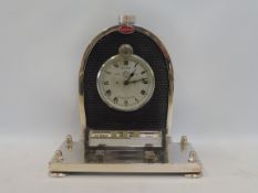 A silver plated desk piece in the form of a Bugatti radiator with inset Jaeger car clock by Glyn