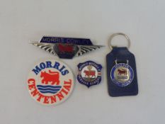 A Morris Motors Ltd Service School enamel lapel badge, a Morris Cowley radiator badge, a Morris Mini
