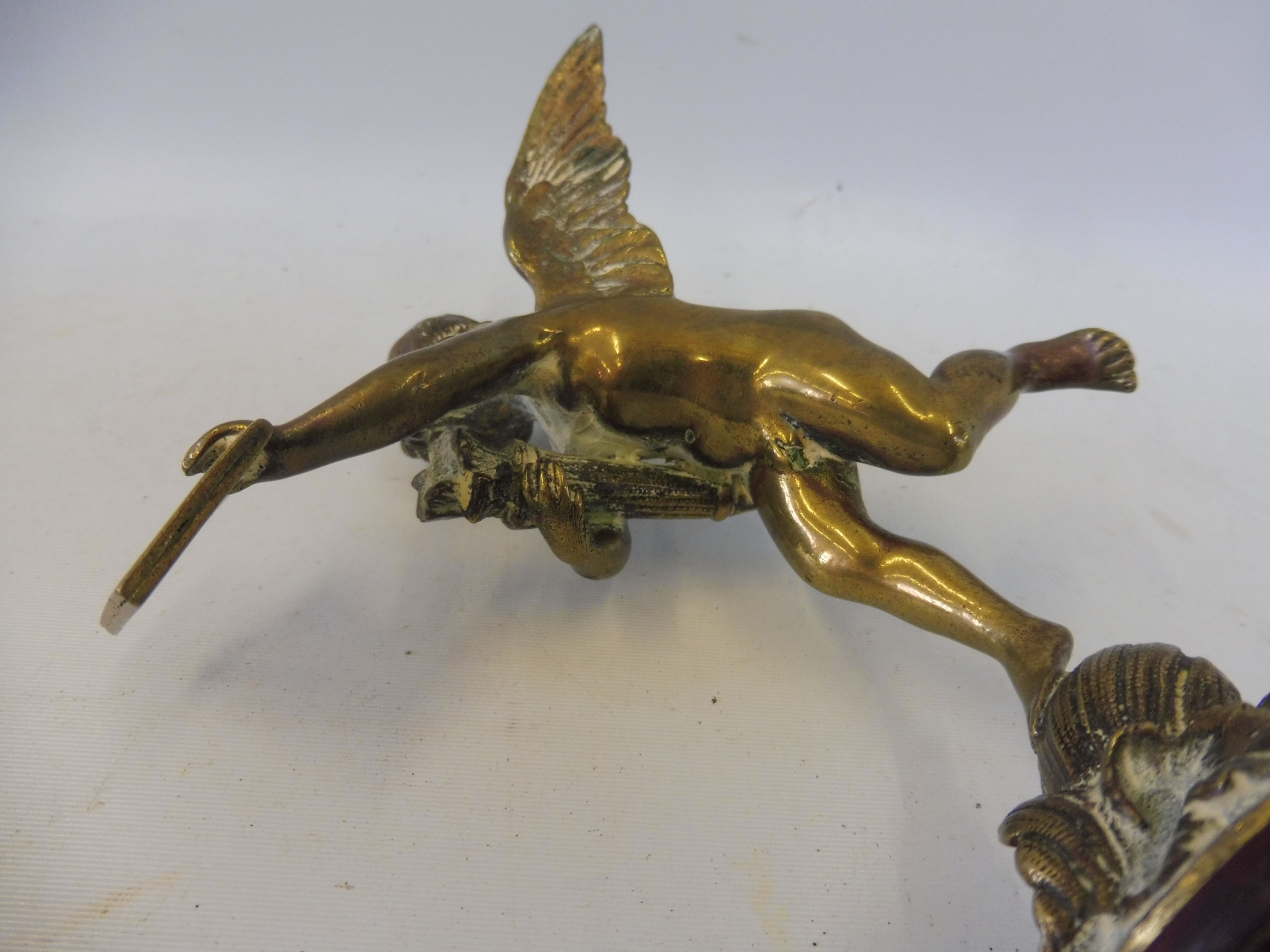 A polished brass accessory mascot in the form of a winged cherub, display base mounted. - Image 4 of 5