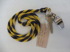 A lanyard and whistle (stamped AA) as worn by the first patrols on the M1.