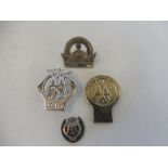 An AA Staff chrome plated lapel badge, an AA Stenson Cooke style lapel badge and two others.
