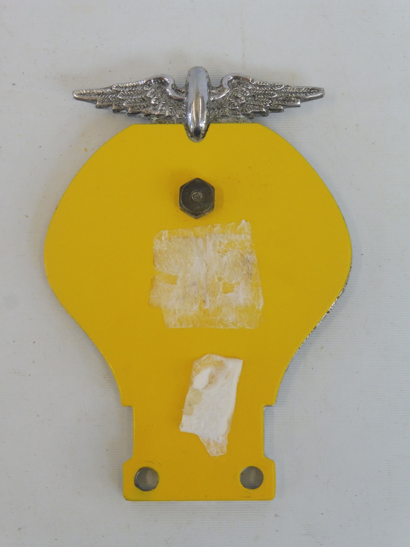 An early yellow back AA motorcycle badge with centre screw, stamped 485-47K circa 1938. - Image 2 of 2