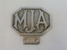 A Jersey Motor Association Commercial 2 badge, late 1930s-1948, chrome plated brass and enamel.