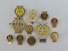 A quantity of early style AA lapel badges.
