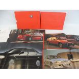 Alfa Romeo - a hardback folio with brochures inside detailing the 164, the Sprint, the 75 and the