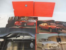 Alfa Romeo - a hardback folio with brochures inside detailing the 164, the Sprint, the 75 and the