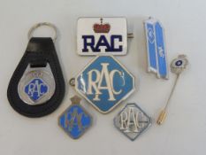 A selection of RAC lapel and other badges including one in the shape of a roadside box, also a tie