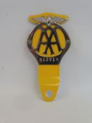 A circa 1937 yellow steel back AA badge long flange version to suit a motorcycle, stamped 31371M.
