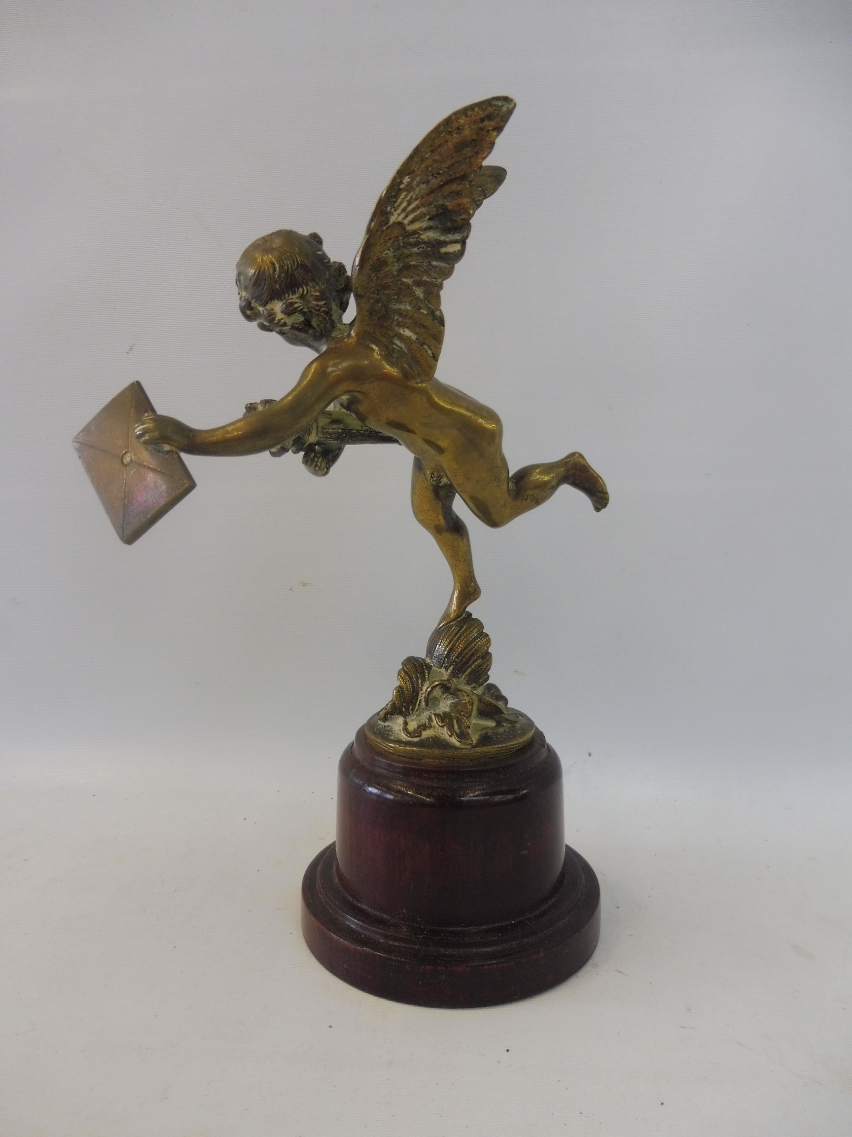 A polished brass accessory mascot in the form of a winged cherub, display base mounted. - Image 3 of 5