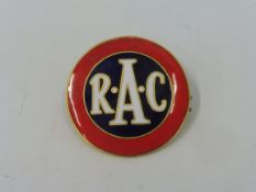 An RAC red and blue 'target' enamel lapel badge, stamped to verso: W.O. Lewis (Badges) Ltd