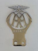 An AA motorcycle badge, stamped 833424, first chrome plated version.