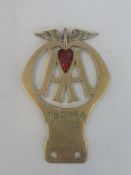 An AA Motorcycle - Cycle Car type 1B badge with red enamel heart shaped token (membership renewal)