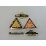 Two Morris Commercial triangular lapel badges, and three others.