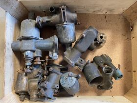 A tray of mostly vintage bronze bodied carburettors.