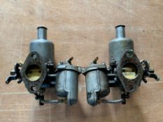 A pair of SU carburettors, formerly fitted to an MGB.