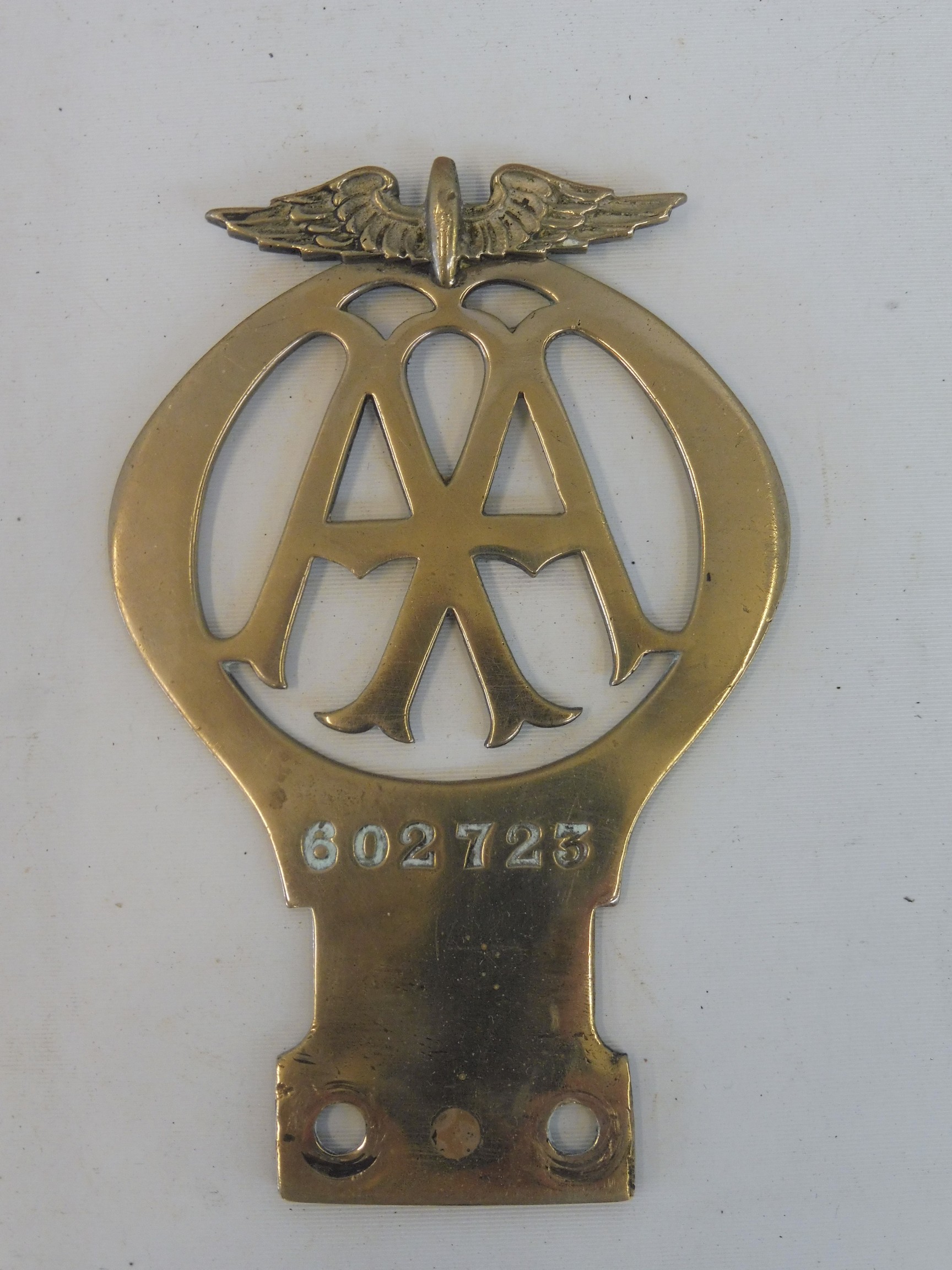 An AA type 1A car badge, nickel, no. 602723, circa 1926.