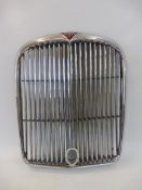 An Alvis TD radiator grille, new old stock and never fitted to a car.