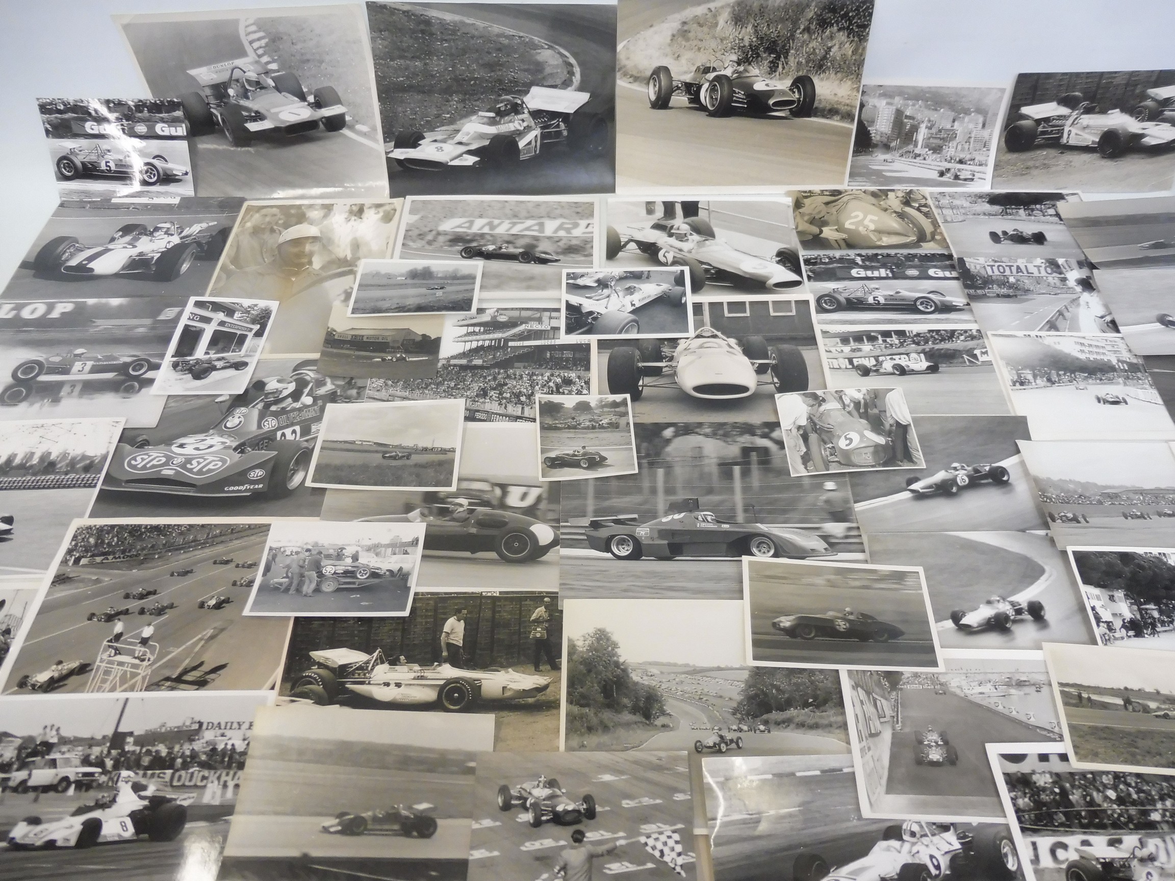 Approximately 56 photographs of various cars including H.R.G., Honda, Lola, March, Cooper,