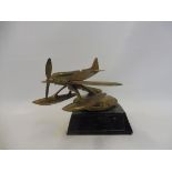 A Schneider Trophy type car mascot in the form of a seaplane on a radiator cap, polished brass, no