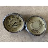 A pair of cream faced instruments 0-70 mph speedometer and a combined amp, fuel and oil gauge,