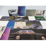 A Jaguar E Type road test plus various Jaguar and Daimler car brochures.