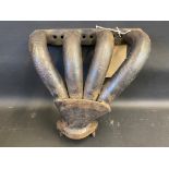 An original Bugatti exhaust manifold, with repairs.