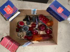 A box of n.o.s. Mini and other lamps, Lucas lenses, reflectors etc.