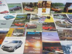 A quantity of Japanese brochures including Nissan, Datsun, Mazda, Honda, Subaru and Toyota.