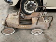 A toy fire engine pedal car for restoration.