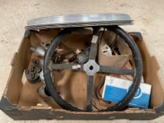 A box of asssorted Morris parts including a dished steering wheel, SU carburettor etc.